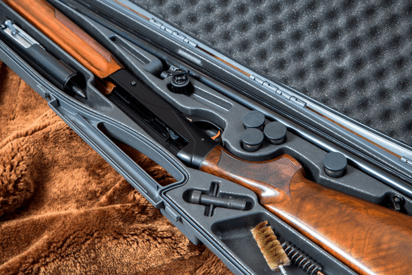 shotgun in a grey padded gun case