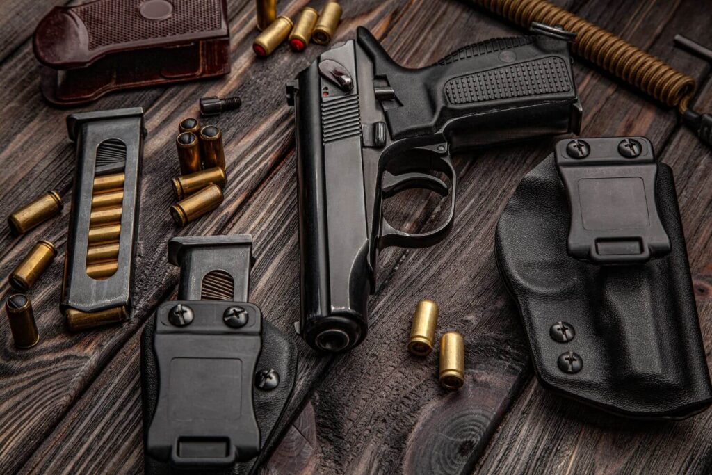 Firearm Bullets and Holster Sitting on a Wooden Background