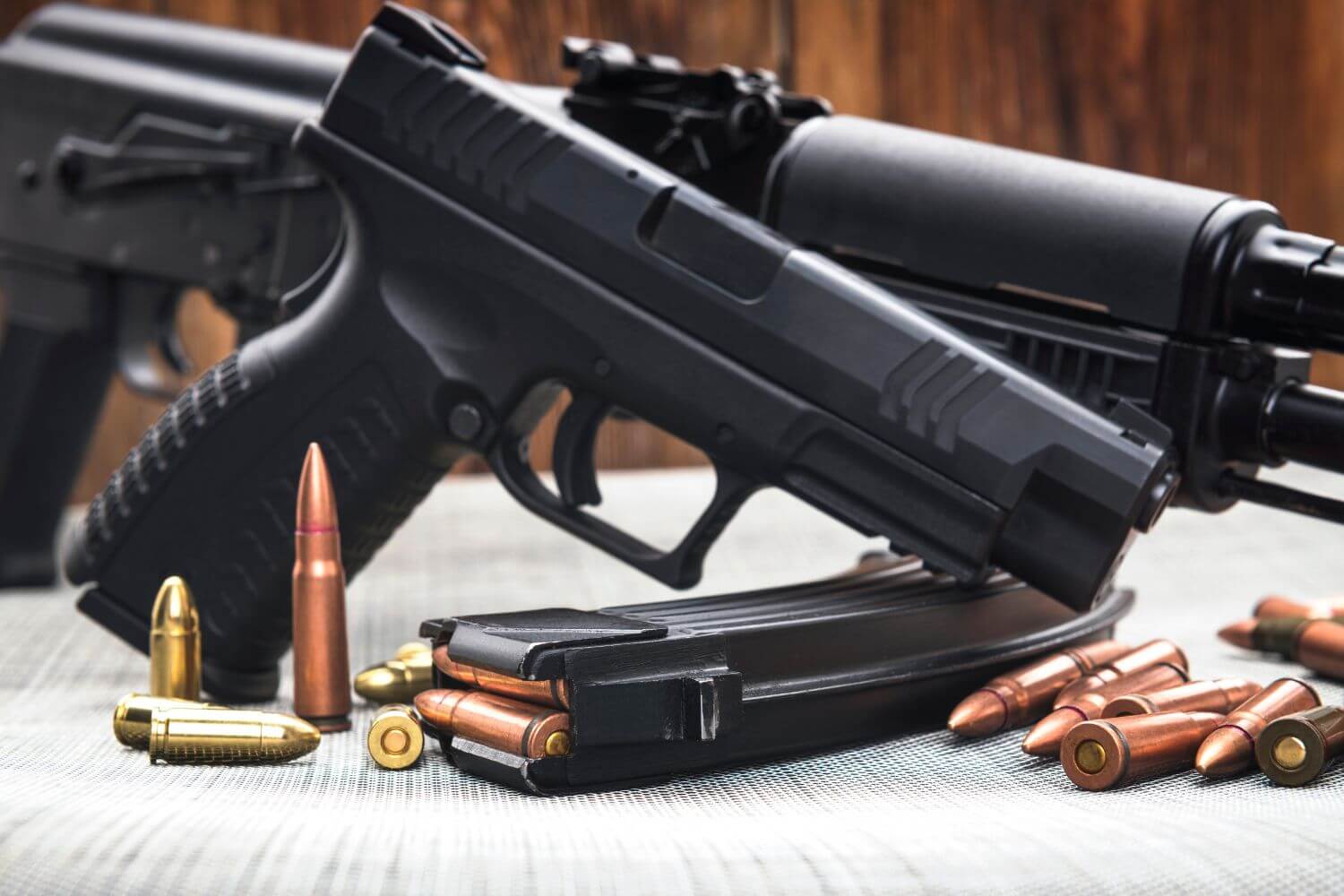 Guns and Ammunition Sitting on a Table