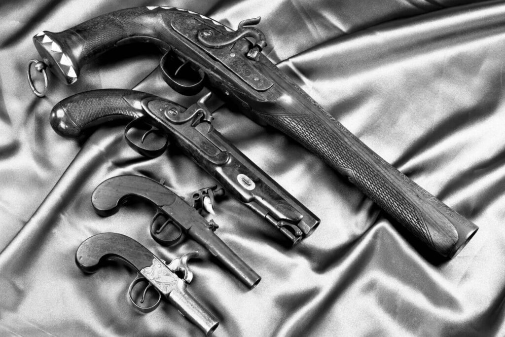 Collection of four antique pistols
