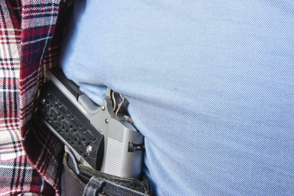 Man with a Pistol Holstered in His Waistband