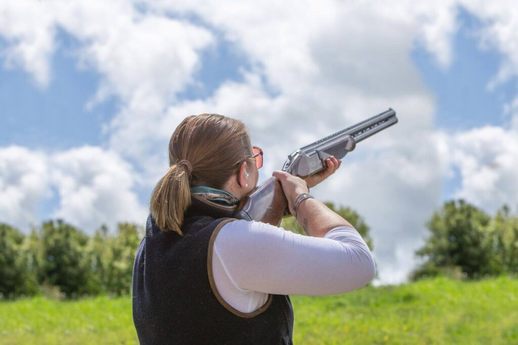 Woman Clay Shooting in a Field