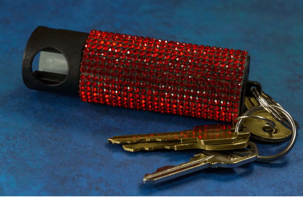 Pepper spray bedazzled in red rhinestones and attached to a set of keys - Pennsylvania Gun Shows | Get Tickets For Eagle Shows Pepper Spray Bedazzled in Red Rhinestones and Attached to a Set of Keys