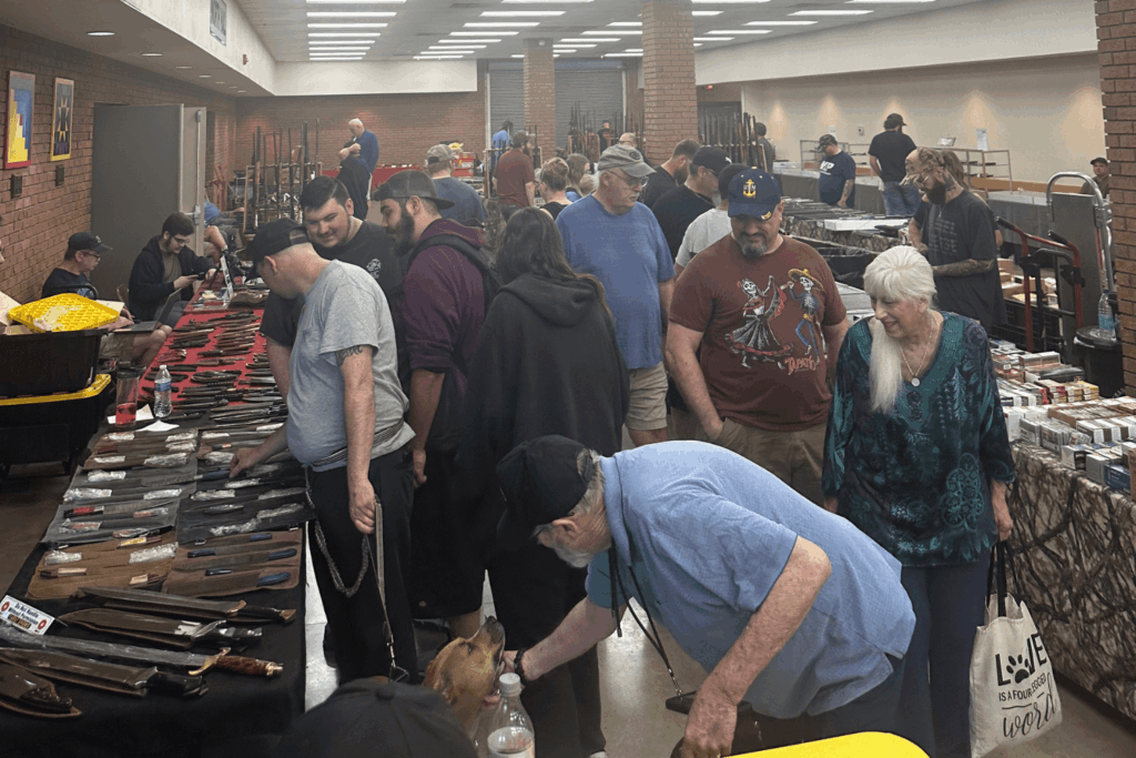 Group of Gun Show Attendees Browsing Tables at an Eagle Shows Event