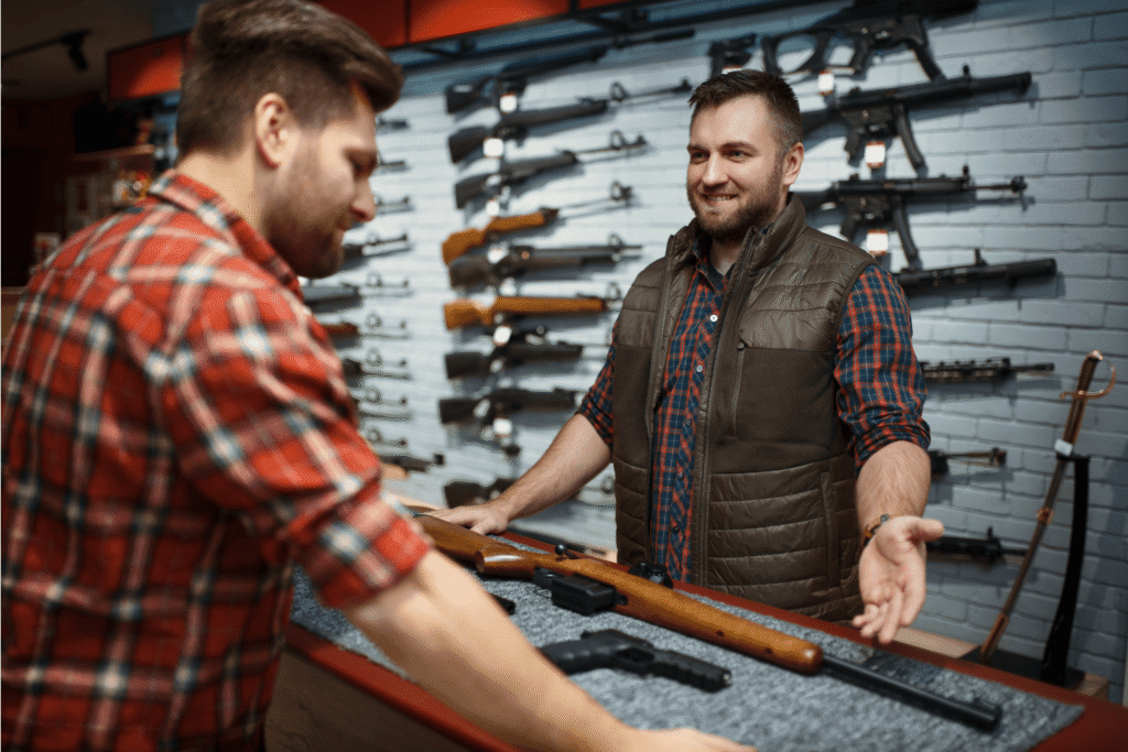 Man Purchasing a Gun is Asking Questions to Gun Shop Owner